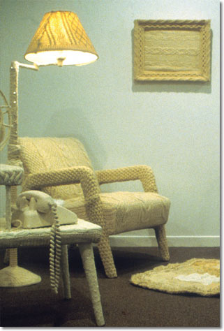 Photo of a chair, covered with knitting.